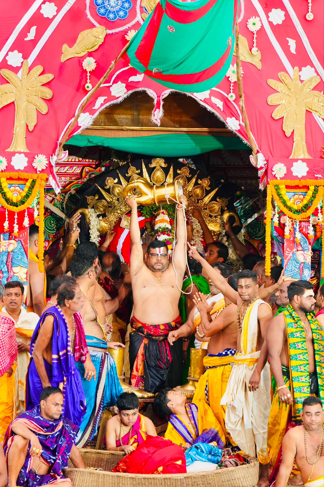The sacred abhisheka performed upon the chariot before the Yatra begins